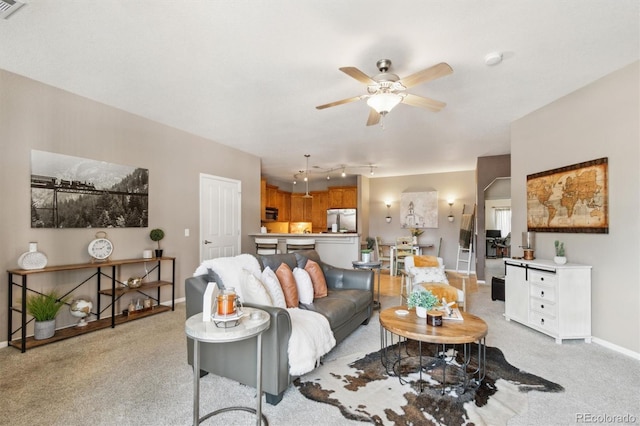 10818 Cimarron St Unit 1102, Firestone, CO 80504 - living area with a ceiling fan, light carpet, and rail lighting