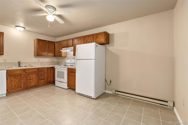 kitchen with a sink, baseboard heating, white appliances, brown cabinetry, and light countertops