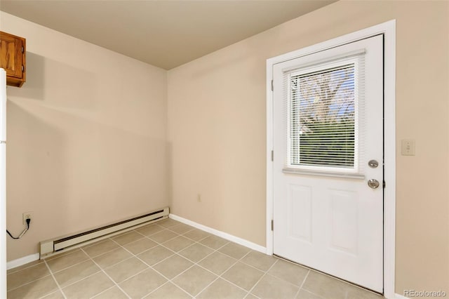 entryway featuring a baseboard radiator, baseboards, and light tile patterned flooring