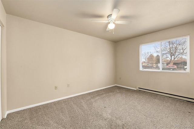 carpeted empty room with baseboard heating, ceiling fan, and baseboards