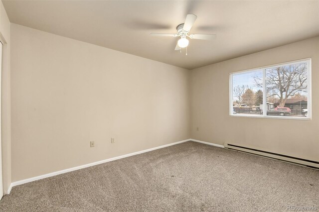 1502 E 5th St, Loveland, CO 80537 - carpeted empty room with baseboard heating, ceiling fan, and baseboards