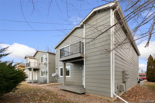 rear view of house with a balcony