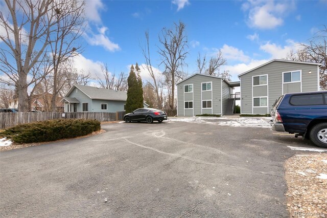 1502 E 5th St, Loveland, CO 80537 - uncovered parking lot with fence and a residential view