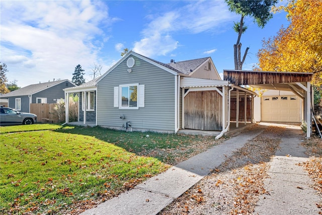 view of front of property with a garage and a front lawn