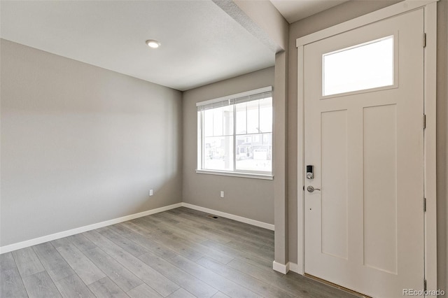 entryway with light hardwood / wood-style floors