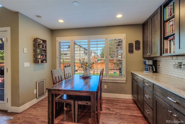 14533 W 69th Pl, Arvada, CO 80004 - dining space with baseboards, wood finished floors, and recessed lighting