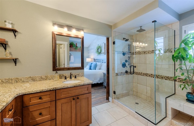 14533 W 69th Pl, Arvada, CO 80004 - ensuite bathroom featuring a shower stall, vanity, and tile patterned flooring