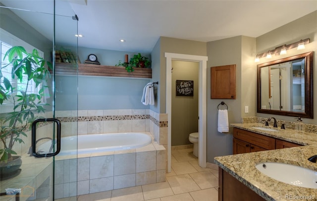 14533 W 69th Pl, Arvada, CO 80004 - full bath with vanity, a bath, toilet, tile patterned floors, and a shower with door