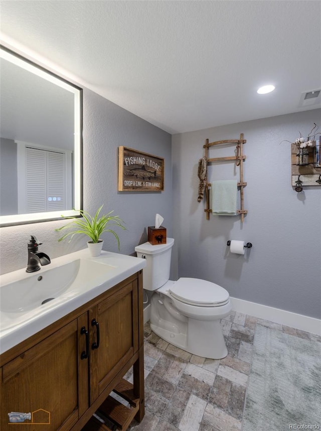 14533 W 69th Pl, Arvada, CO 80004 - half bath featuring vanity, toilet, and baseboards