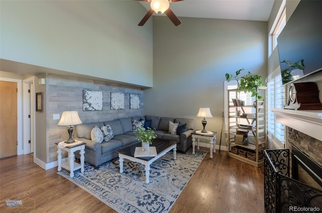 14533 W 69th Pl, Arvada, CO 80004 - living room with a towering ceiling, a ceiling fan, baseboards, and wood finished floors