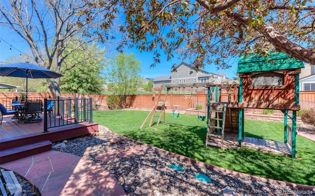 14533 W 69th Pl, Arvada, CO 80004 - view of yard with a playground, outdoor dining area, and a wooden deck