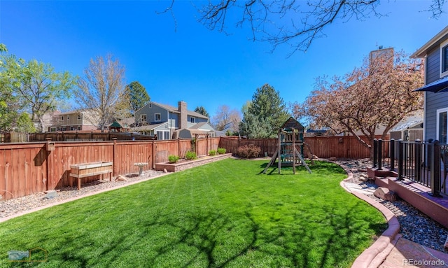 14533 W 69th Pl, Arvada, CO 80004 - view of yard featuring a playground and a residential view