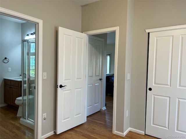 hall with dark hardwood / wood-style floors