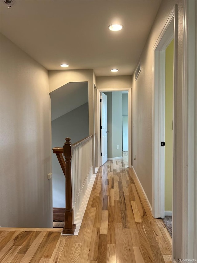 hall with light hardwood / wood-style flooring