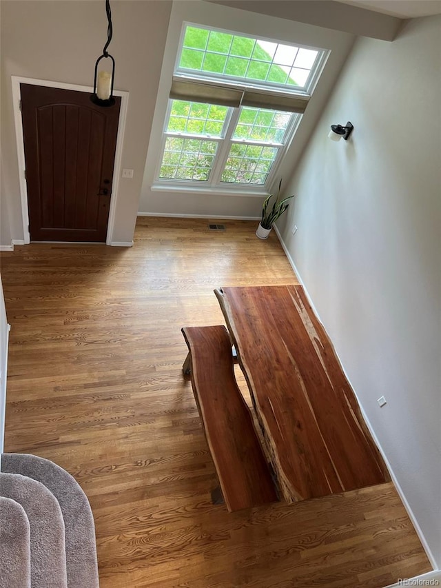 staircase with hardwood / wood-style flooring