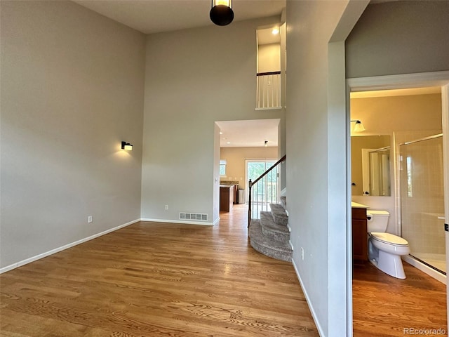 staircase with wood-type flooring