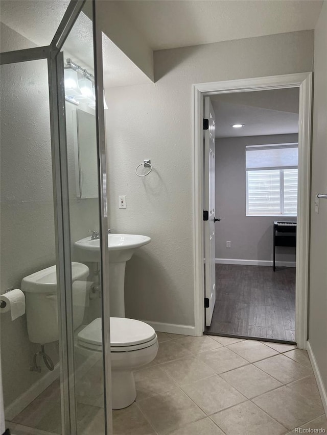 bathroom featuring tile patterned floors and toilet