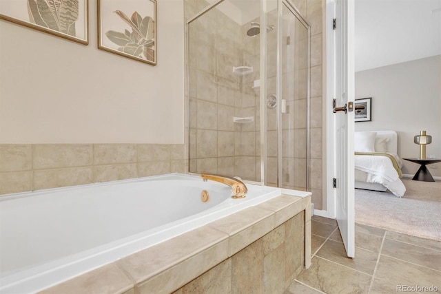 bathroom featuring tile patterned floors and shower with separate bathtub