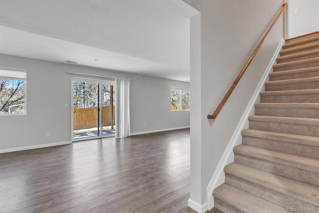 stairway featuring hardwood / wood-style floors