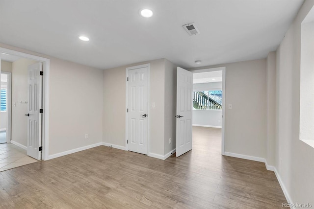 unfurnished room featuring light wood-type flooring