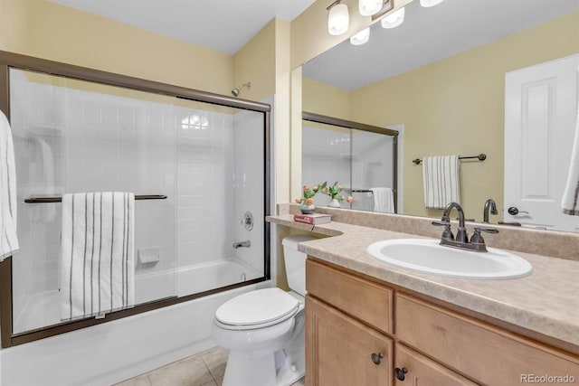 full bathroom featuring radiator, shower / bath combination with glass door, vanity, toilet, and tile patterned floors