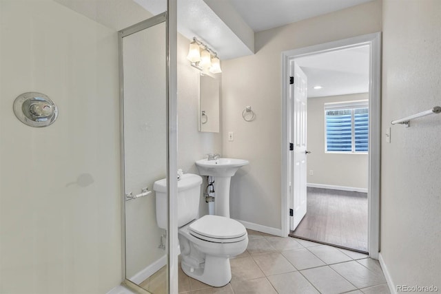 bathroom with tile patterned floors and toilet