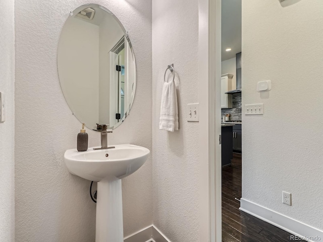 10479 E 25th Dr, Aurora, CO 80010 - bathroom with wood finished floors and baseboards