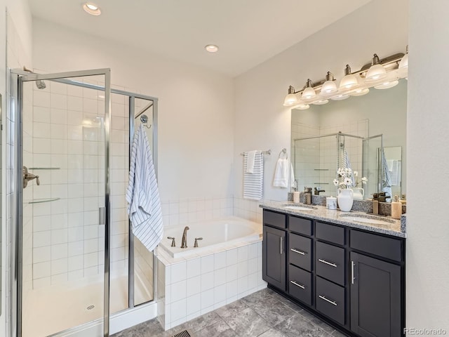 10479 E 25th Dr, Aurora, CO 80010 - bathroom with a garden tub, a shower stall, double vanity, and recessed lighting