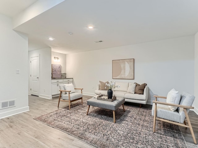 10479 E 25th Dr, Aurora, CO 80010 - living area featuring light wood-type flooring and recessed lighting