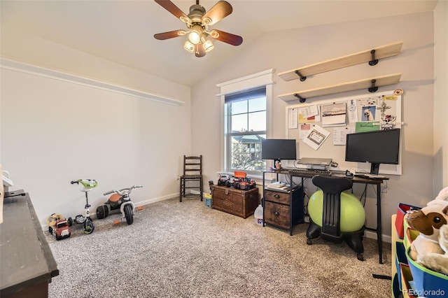 home office with lofted ceiling, ceiling fan, baseboards, and light colored carpet