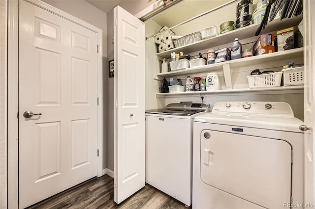 laundry room featuring dark wood-style floors, laundry area, and washer and dryer