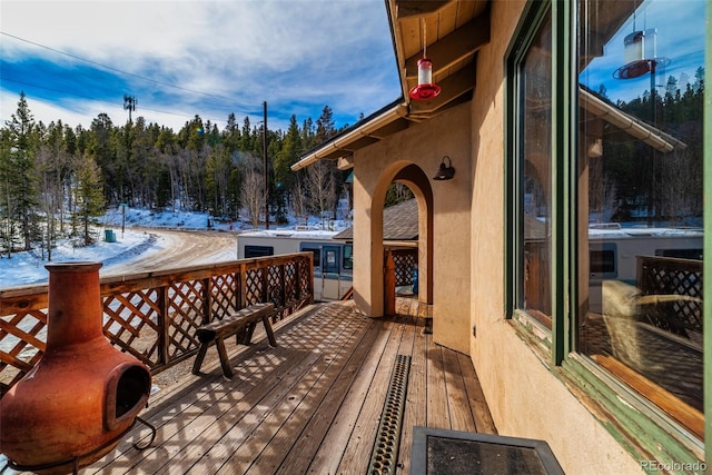 view of snow covered deck