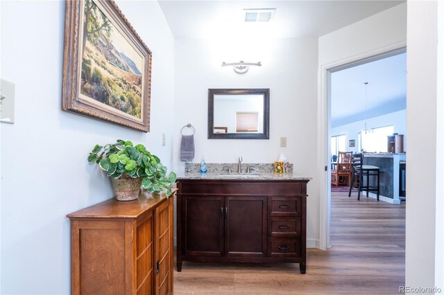 11865 Rangeview Cir, Salida, CO 81201 - indoor wet bar featuring light wood-style floors and baseboards