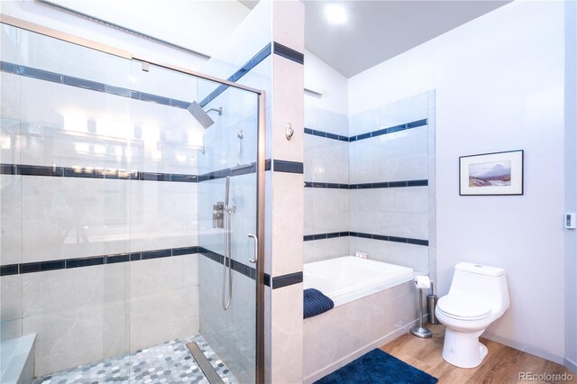 11865 Rangeview Cir, Salida, CO 81201 - full bath featuring a garden tub, toilet, wood finished floors, and a stall shower