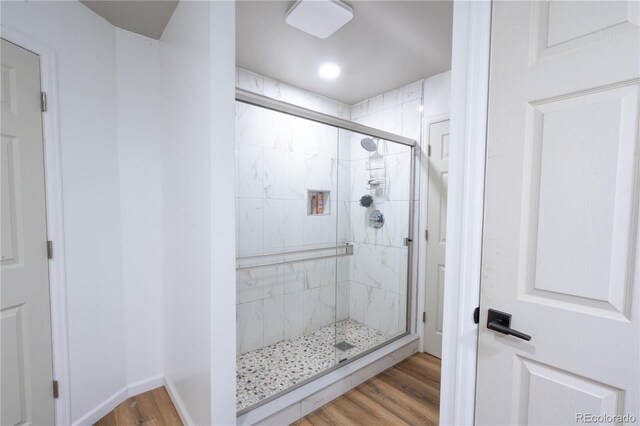 11865 Rangeview Cir, Salida, CO 81201 - bathroom with wood finished floors, a shower stall, and baseboards