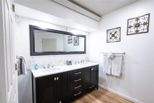 11865 Rangeview Cir, Salida, CO 81201 - full bath featuring double vanity, wood finished floors, and baseboards
