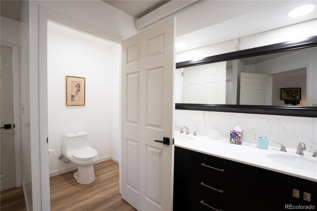 11865 Rangeview Cir, Salida, CO 81201 - full bath with vanity, toilet, wood finished floors, and baseboards