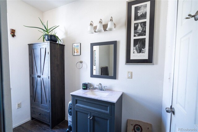11865 Rangeview Cir, Salida, CO 81201 - bathroom with vanity, wood finished floors, and baseboards