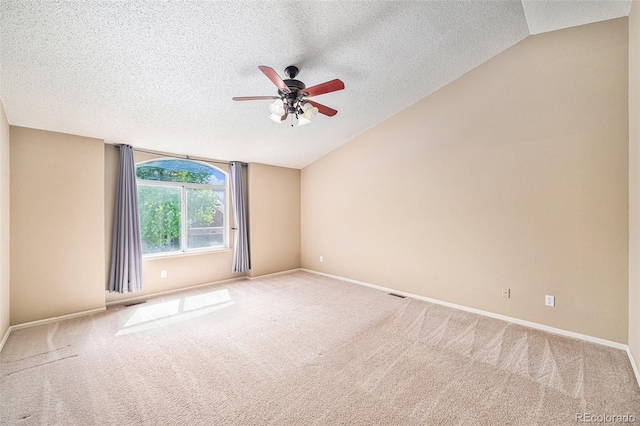 5573 S Taft St, Littleton, CO 80127 - spare room featuring lofted ceiling, a textured ceiling, ceiling fan, carpet floors, and baseboards