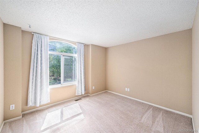 5573 S Taft St, Littleton, CO 80127 - carpeted empty room featuring a textured ceiling and baseboards