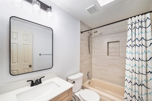 5573 S Taft St, Littleton, CO 80127 - full bathroom with shower / bath combination with curtain, vanity, and toilet