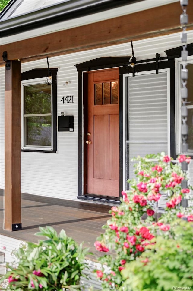 4421 Raleigh St, Denver, CO 80212 - doorway to property with a porch