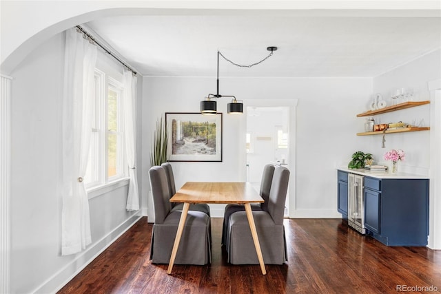 4421 Raleigh St, Denver, CO 80212 - dining room with dark wood finished floors, arched walkways, and beverage cooler