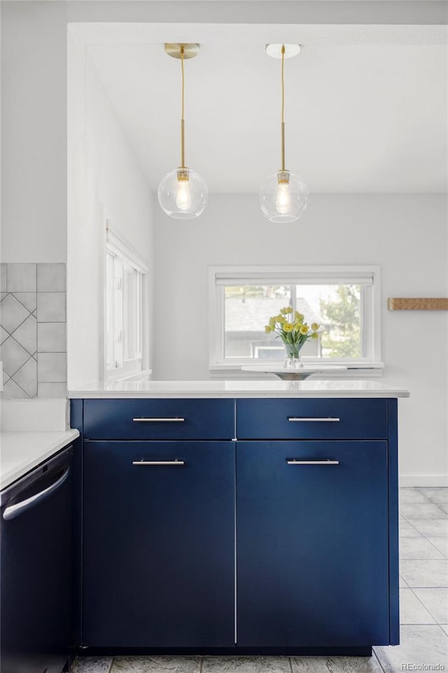 4421 Raleigh St, Denver, CO 80212 - kitchen featuring blue cabinets, dishwasher, light countertops, and hanging light fixtures