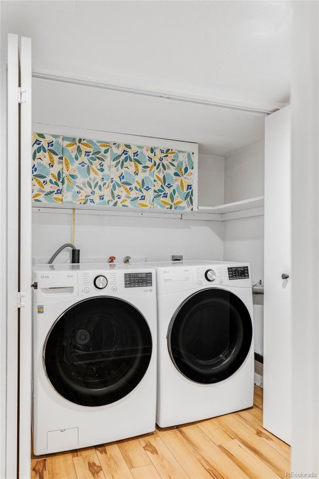 4421 Raleigh St, Denver, CO 80212 - laundry room featuring independent washer and dryer and wood finished floors