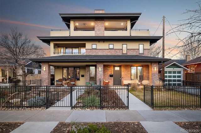 view of front of property with a porch and a balcony