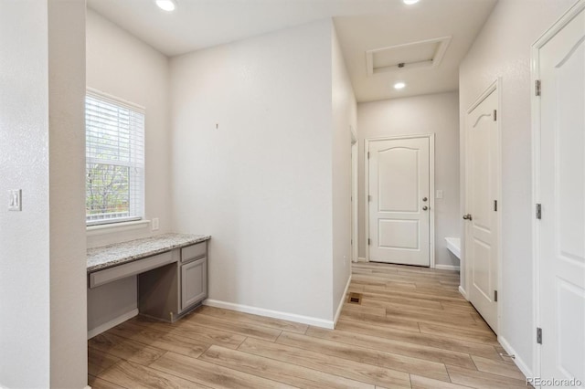 3831 E 141st Ave, Thornton, CO 80602 - hallway featuring light wood finished floors, attic access, an office area, recessed lighting, and baseboards