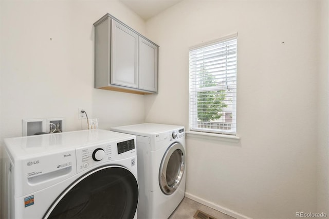 3831 E 141st Ave, Thornton, CO 80602 - laundry area featuring cabinet space, washer and dryer, baseboards, and light tile patterned floors