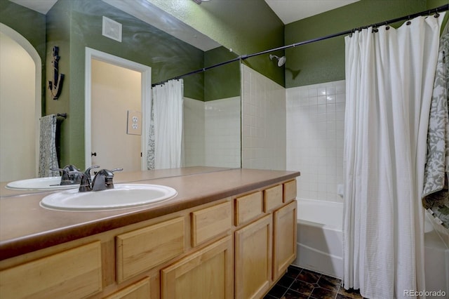 bathroom with vanity, tile patterned flooring, and shower / tub combo