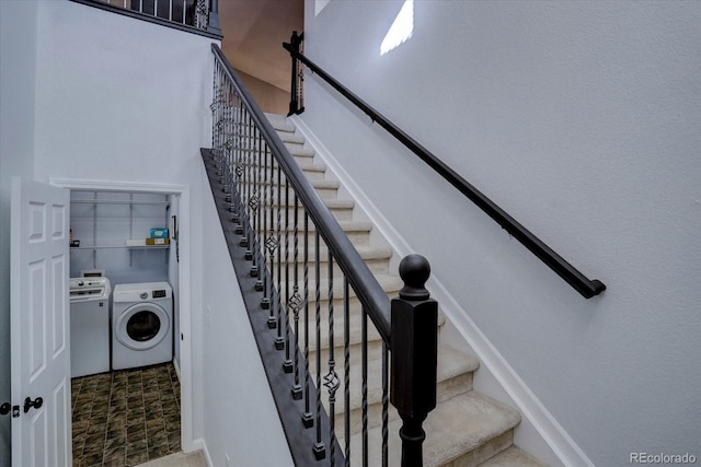 stairway featuring washing machine and clothes dryer